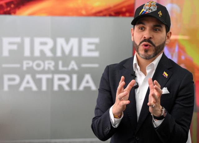 (FILES) Colombian presidential candidate Abelardo de la Espriella, of the political movement Defensores de la Patria, speaks during an interview with AFP in Bogota on February 11, 2026. Colombians head to the polls to pick a new president between a hard-right White House-backed lawyer and a leftist senator that will decide the fate of the country's stumbling peace process and strained ties with Washington. (Photo by Luis ACOSTA / AFP)