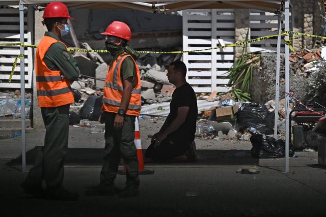 Jordan's rescue workers remain near a collapsed building in Caraballeda, La Guaira state, Venezuela, on July 1, 2026, following the June 24 twin earthquakes. Venezuelans, with help from around the world, were still searching on July 1, 2026 for survivors a week after massive earthquakes killed nearly 2,000 and left thousands unaccounted for. (Photo by Juan BARRETO / AFP)