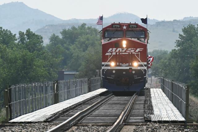 US President Donald Trump rides the "Freedom250 train" on his way to attend the grand opening of the Theodore Roosevelt Presidential Library in Medora, North Dakota, July 1, 2026. . (Photo by SAUL LOEB / AFP)