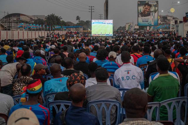 Democratic Republic of Congo supporters watch the 2026 World Cup round of 32 football match between England and Democratic Republic of Congo on a giant screen at a fan zone in Kinshasa on July 1, 2026. (Photo by Hardy BOPE / AFP)