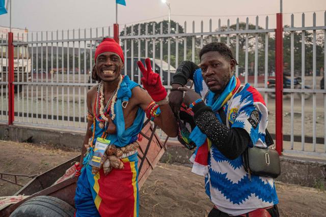 Democratic Republic of Congo supporters pose for a photograph as they watch the 2026 World Cup round of 32 football match between England and Democratic Republic of Congo at a fan zone in Kinshasa on July 1, 2026. (Photo by Hardy BOPE / AFP)