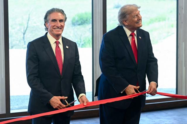 US Secretary of the Interior Doug Burgum (L) and US President Donald Trump take part in a ribbon cutting during a ceremony at the newly opened Theodore Roosevelt Presidential Library in Medora, North Dakota, on July 1, 2026. (Photo by SAUL LOEB / AFP)
