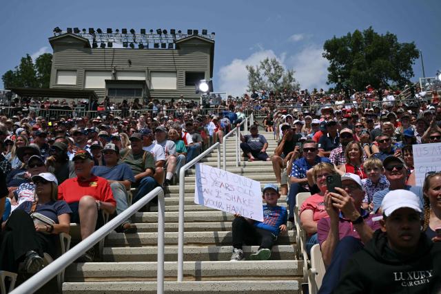 People listen as the US president speaks at the Burning Hills Amphitheatre after he attended the opening of the Theodore Roosevelt Presidential Library in Medora, North Dakota, on July 1, 2026. (Photo by SAUL LOEB / AFP)