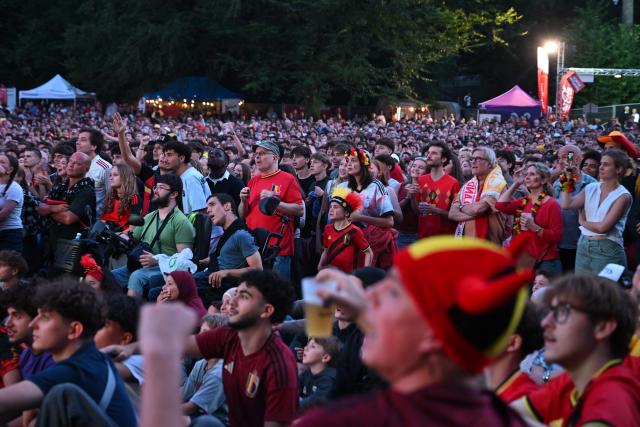 Belgium supporters watch the 2026 World Cup round of 32 football match between Belgium and Senegal at a fan park in Uccle, southern Brussels, on July 1, 2026. (Photo by Nicolas TUCAT / AFP)