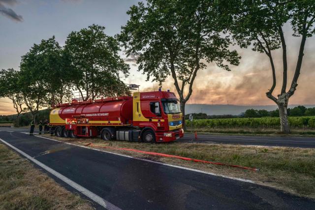 This photograph shows a French civil security truck carrying fire retardant during a wildfire in Pouzols-Minervois, southwestern of France, on July 1, 2026. (Photo by Idriss Bigou-Gilles / AFP)