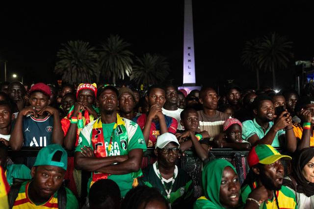 Senegal supporters watch the 2026 World Cup round of 32 football match between Belgium and Senegal at the FIFA Fan Zone at the Place de l'Obelisque in Dakar on July 1, 2026. (Photo by Patrick Meinhardt / AFP)