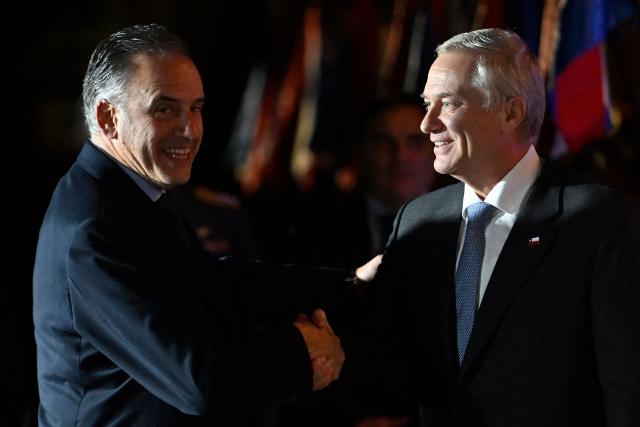 Chile's President Jose Antonio Kast (R) is greeted by Uruguay's President Yamandu Orsi upon arrival for a meeting at the Suarez residency in Montevideo on July 1, 2026. (Photo by Santiago Mazzarovich / AFP)