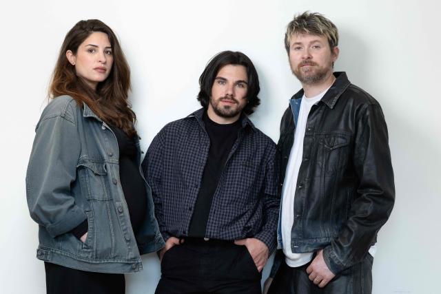 (FILES) The founding members of the choreographic collective "(LA)HORDE" (from L) Marine Brutti, Arthur Harel and Jonathan Debrouwer pose during a photo session in Paris on June 10, 2026. The world premiere of the new creation by the collective (LA)HORDE, known for choreographing shows for stars such as Rosalia and Madonna, split the audience at the 46th Montpellier Danse festival. "Après moi, le déluge," the collective's third creation since their appointment as heads of the choreographic center of the Ballet National de Marseille in 2019, is a succession of scenes with dark, dystopian tones, linked together without a narrative and presented on June 30 and July 1, 2026, at this major gathering of contemporary dance. (Photo by Joël SAGET / AFP)