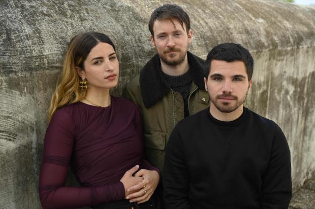 (FILES) Directors of "LA(HORDE)" (L to R) French Marine Brutti, Jonathan Lebrouwer, and Arthur Harel pose on the roof of Marseille ballet on April 16, 2021. The world premiere of the new creation by the collective (LA)HORDE, known for choreographing shows for stars such as Rosalia and Madonna, split the audience at the 46th Montpellier Danse festival. "Après moi, le déluge," the collective's third creation since their appointment as heads of the choreographic center of the Ballet National de Marseille in 2019, is a succession of scenes with dark, dystopian tones, linked together without a narrative and presented on June 30 and July 1, 2026, at this major gathering of contemporary dance. (Photo by Christophe SIMON / AFP)