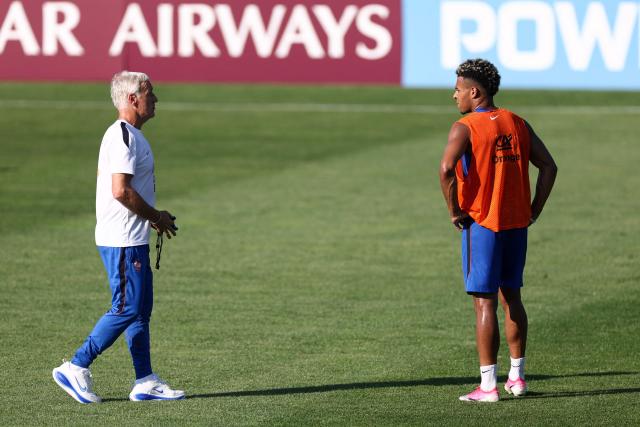 France's head coach Didier Deschamps (L) and forward #20 Desire Doue (R) talk in a training session at Bentley University in Waltham, near Boston, on July 1, 2026, during the 2026 World Cup football tournament. (Photo by FRANCK FIFE / AFP)