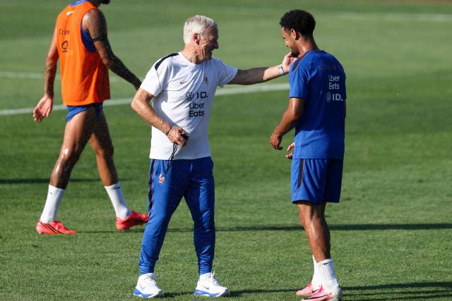 France's head coach Didier Deschamps (L) and midfielder #18 Warren Zaire-Emery (R) talk in a training session at Bentley University in Waltham, near Boston, on July 1, 2026, during the 2026 World Cup football tournament. (Photo by FRANCK FIFE / AFP)