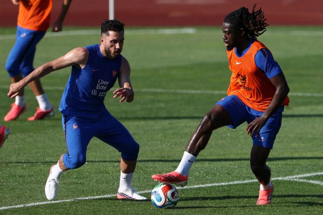 France's forward #24 Rayan Cherki (L) and midfielder #06 Manu Kone (R) take part in a training session at Bentley University in Waltham, near Boston, on July 1, 2026, during the 2026 World Cup football tournament. (Photo by FRANCK FIFE / AFP)