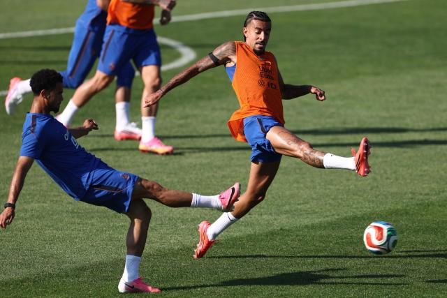 France's defender #02 Malo Gusto (R) and midfielder #18 Warren Zaire-Emery (L) take part in a training session at Bentley University in Waltham, near Boston, on July 1, 2026, during the 2026 World Cup football tournament. (Photo by FRANCK FIFE / AFP)