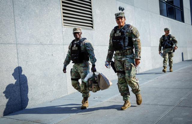 US Army soldiers patrol around Madison Square Garden in New York on July 1, 2026. Increasing signs point to a mega-bash for the A-list celebrity couple Taylor Swift and Travis Kelce at Madison Square Garden this week. Rumors have run rampant for weeks that the 36-year-old pop superstar and the three-time NFL Super Bowl winner, both 36, could wed at the storied sports arena, home to the New York Knicks, the newly crowned NBA champions. (Photo by kena betancur / AFP)