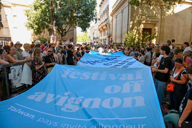 (FILES) Actors and musicians take part in the parade of the "Festival Off Avignon" theatre event, in Avignon, southern France, on July 2, 2024. The Avignon festival, a major international theater event, opens July 4, 2026, amidst a desire to celebrate and concerns within a sector affected by threats to creative freedom and budget cuts. At the same time, the Festival Off — with its roughly 1,700 shows — will transform the city into a performing arts marketplace, delighting a loyal audience. (Photo by Sylvain THOMAS / AFP)