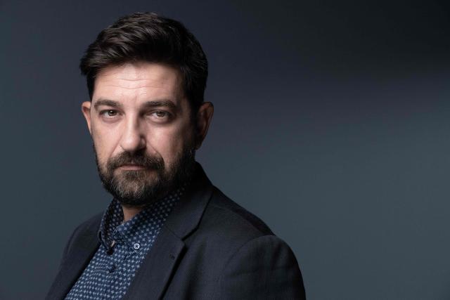 (FILES) Portuguese theatre actor, director, dramaturge and director of the Festival d'Avignon Tiago Rodrigues, poses during a photo session in Paris on September 15, 2022. The Avignon festival, a major international theater event, opens July 4, 2026, amidst a desire to celebrate and concerns within a sector affected by threats to creative freedom and budget cuts. At the same time, the Festival Off — with its roughly 1,700 shows — will transform the city into a performing arts marketplace, delighting a loyal audience. (Photo by Joлl SAGET / AFP)