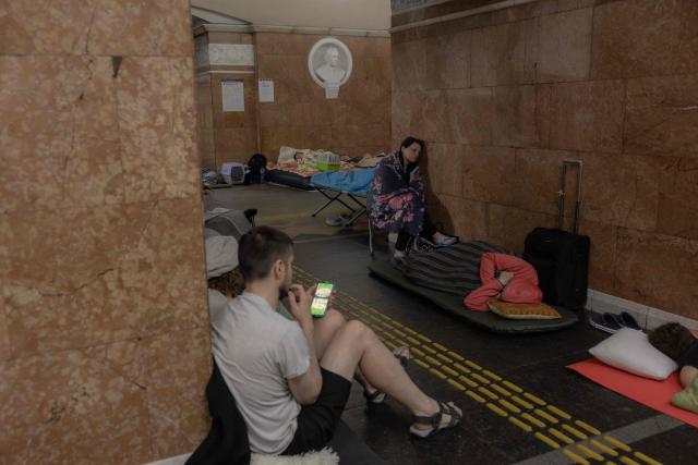 People take shelter at a metro station during Russian air attacks on Kyiv, early on July 2, 2026, amid the Russian invasion of Ukraine. AFP journalists in the central and eastern districts of Kyiv heard more than a dozen explosions, as the city's Mayor Vitali Klitschko said on Telegram that "Kyiv is under attack from ballistic missiles and UAVs". (Photo by Roman PILIPEY / AFP)