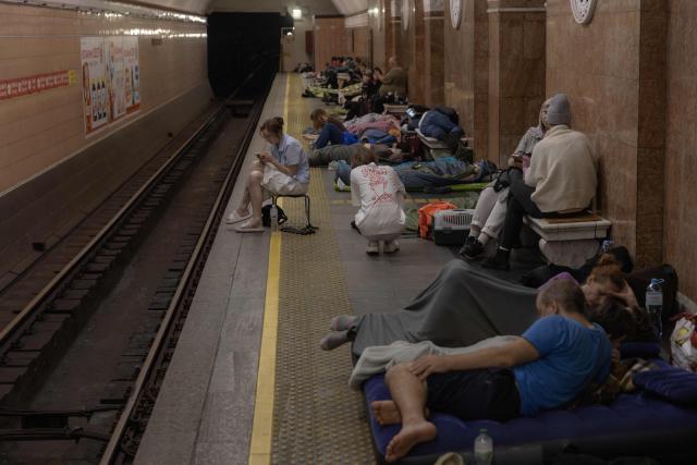 People take shelter at a metro station during Russian air attacks on Kyiv, early on July 2, 2026, amid the Russian invasion of Ukraine. AFP journalists in the central and eastern districts of Kyiv heard more than a dozen explosions, as the city's Mayor Vitali Klitschko said on Telegram that "Kyiv is under attack from ballistic missiles and UAVs". (Photo by Roman PILIPEY / AFP)
