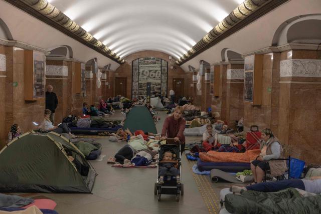 People take shelter at a metro station during Russian air attacks on Kyiv, early on July 2, 2026, amid the Russian invasion of Ukraine. AFP journalists in the central and eastern districts of Kyiv heard more than a dozen explosions, as the city's Mayor Vitali Klitschko said on Telegram that "Kyiv is under attack from ballistic missiles and UAVs". (Photo by Roman PILIPEY / AFP)
