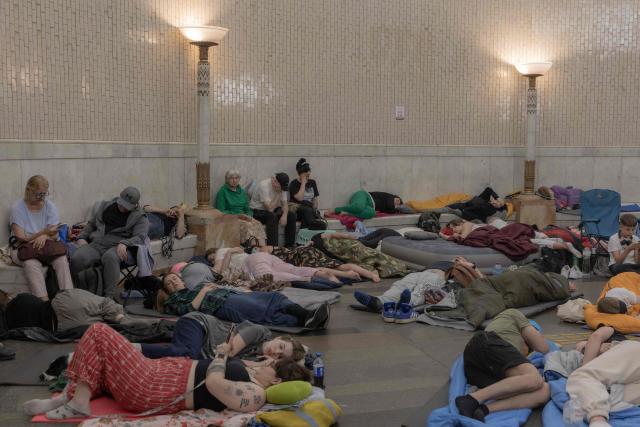 People take shelter at a metro station during Russian air attacks on Kyiv, early on July 2, 2026, amid the Russian invasion of Ukraine. AFP journalists in the central and eastern districts of Kyiv heard more than a dozen explosions, as the city's Mayor Vitali Klitschko said on Telegram that "Kyiv is under attack from ballistic missiles and UAVs". (Photo by Roman PILIPEY / AFP)