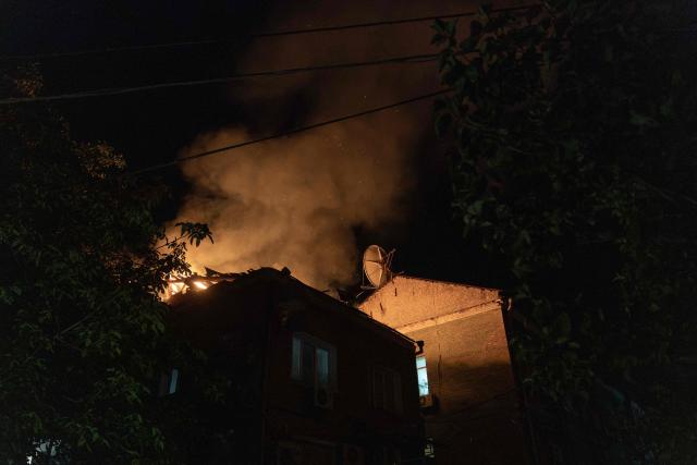 A building burns after being struck by a drone during a Russian air attack on Kyiv late on July 1, 2026. AFP journalists in the central and eastern districts of Kyiv heard more than a dozen explosions, as the city's Mayor Vitali Klitschko said on Telegram that "Kyiv is under attack from ballistic missiles and UAVs". (Photo by Roman PILIPEY / AFP)