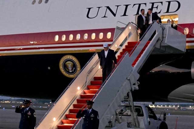 US President Donald Trump disembarks from Air Force One at Joint Base Andrews, Maryland on July 1, 2026. Trump is returning from North Dakota after attending the grand opening of the Theodore Roosevelt Presidential Library. This is his first trip aboard the Boeing 747-8 that Qatar gifted the United States to use for executive travel. (Photo by SAUL LOEB / AFP)