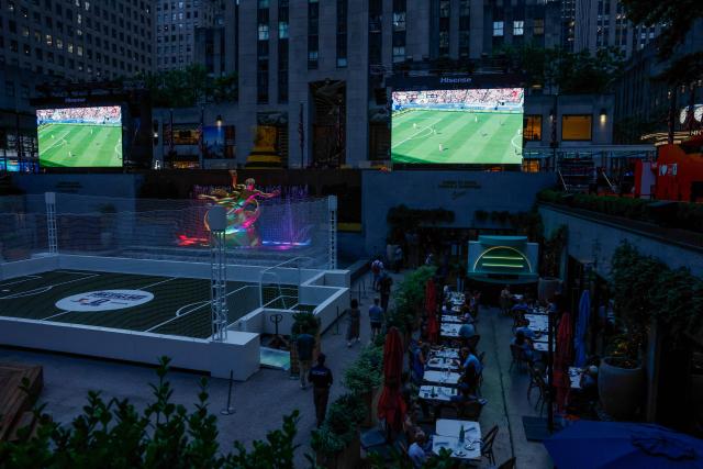 Fans gather to watch the 2026 World Cup match between USA and Bosnia and Herzegovina at the Rockefeller center in New York, on July 1, 2026. (Photo by kena betancur / AFP)