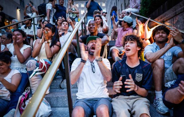 US fans react as people gather to watch the 2026 World Cup match between USA and Bosnia and Herzegovina at the Rockefeller center in New York, on July 1, 2026. (Photo by kena betancur / AFP)