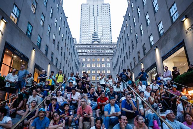Fans gather to watch the 2026 World Cup match between USA and Bosnia and Herzegovina at the Rockefeller center in New York, on July 1, 2026. (Photo by kena betancur / AFP)