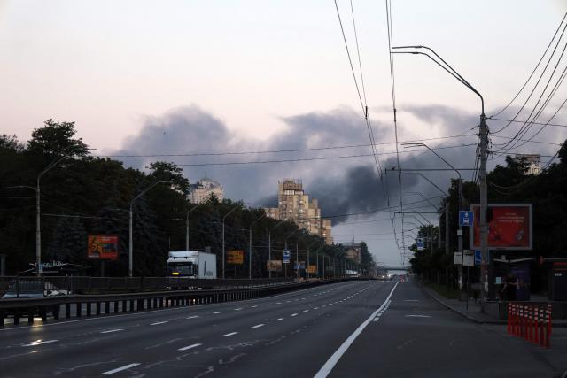 Smoke rises during a Russian missile strike on the Ukrainian capital of Kyiv on July 2, 2026, amid the Russian invasion in Ukraine. Russian missile and drone strikes rocked Kyiv early on July 2, killing two people and wounding more than a dozen, after President Volodymyr Zelensky warned that Moscow was preparing a "massive attack". (Photo by Serhii Okunev / AFP)