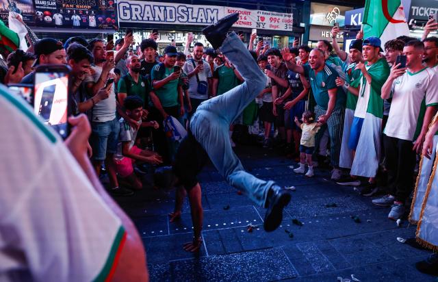 Fans wearing Algeria jerseys gather in Times Square in New York during the 2026 World Cup Competition on July 1, 2026. (Photo by kena betancur / AFP)