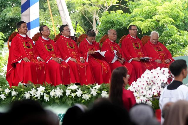 Priests attend the beatification mass for the late Vietnamese Catholic priest Francis Xavier Truong Buu Diep at the Tac Say Pilgrimage Center in Ca Mau province in southern Vietnam. The first beatification ceremony was held in Vietnam in the nearly 500-year history of the Catholic Church in the country. (Photo by AFP)