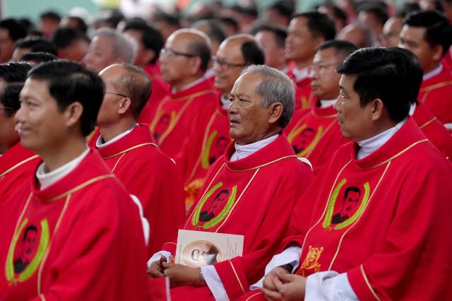 Priests attend the beatification mass for the late Vietnamese Catholic priest Francis Xavier Truong Buu Diep at the Tac Say Pilgrimage Center in Ca Mau province in southern Vietnam. The first beatification ceremony was held in Vietnam in the nearly 500-year history of the Catholic Church in the country. (Photo by AFP)