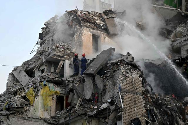 Rescuers extinguish a fire and work in a damaged residential building following missile strikes on the Ukrainian capital of Kyiv on July 2, 2026, amid the Russian invasion of Ukraine. Russian missile and drone strikes rocked Kyiv early on July 2, killing at least eight people and wounding dozens, after President Volodymyr Zelensky warned that Moscow was preparing a "massive attack". (Photo by Genya SAVILOV / AFP)
