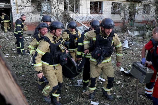 Rescuers carry a wounded person from a damaged residential building following missile strikes on the Ukrainian capital of Kyiv on July 2, 2026, amid the Russian invasion of Ukraine. Russian missile and drone strikes rocked Kyiv early on July 2, killing at least eight people and wounding dozens, after President Volodymyr Zelensky warned that Moscow was preparing a "massive attack". (Photo by Serhii Okunev / AFP)
