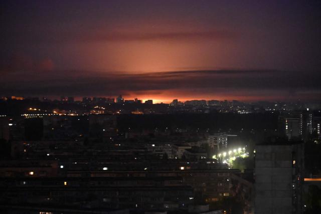 A glow from an explosion is seen during a Russian missile strike on the Ukrainian capital Kyiv on July 2, 2026, amid the Russian invasion in Ukraine. Russian missile and drone strikes rocked Kyiv early on July 2, killing at least eight people and wounding dozens, after President Volodymyr Zelensky warned that Moscow was preparing a "massive attack". (Photo by Eugene KOTENKO / AFP)