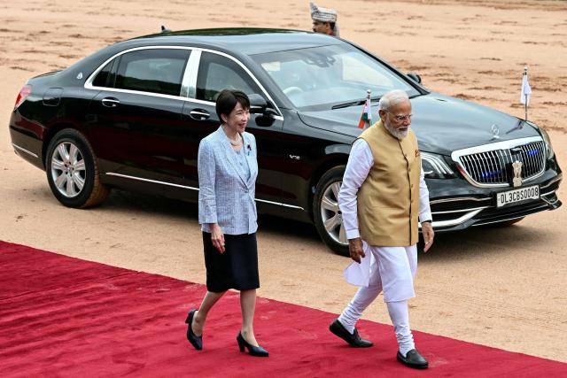 Japan's Prime Minister Sanae Takaichi (L) walks with India's Prime Minister Narendra Modi during her ceremonial reception at India's presidential palace, Rashtrapati Bhavan, in New Delhi on July 2, 2026. (Photo by Sajjad HUSSAIN / AFP)