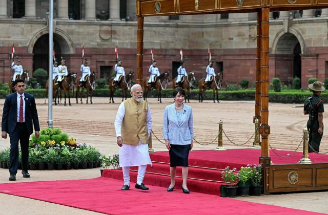 Japan's Prime Minister Sanae Takaichi (centre R) walks with India's Prime Minister Narendra Modi (centre L) during her ceremonial reception at India's presidential palace, Rashtrapati Bhavan, in New Delhi on July 2, 2026. (Photo by Sajjad HUSSAIN / AFP)