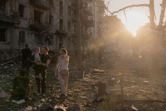 Residents gather at the site of a residential building damaged following a Russian air attack on the Ukrainian capital of Kyiv on July 2, 2026, amid the Russian invasion in Ukraine. Russian missile and drone strikes rocked Kyiv early on July 2, killing at least eight people and wounding dozens, after President Volodymyr Zelensky warned that Moscow was preparing a "massive attack". (Photo by Roman PILIPEY / AFP)