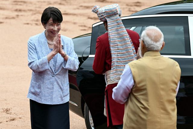 India's Prime Minister Narendra Modi (R) greets Japan's Prime Minister Sanae Takaichi during her ceremonial reception at India's presidential palace, Rashtrapati Bhavan, in New Delhi on July 2, 2026. (Photo by Sajjad HUSSAIN / AFP)