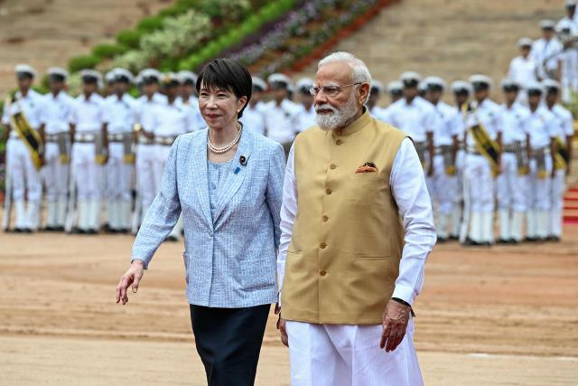 India's Prime Minister Narendra Modi (R) walks with Japan's Prime Minister Sanae Takaichi during her ceremonial reception at India's presidential palace, Rashtrapati Bhavan, in New Delhi on July 2, 2026. (Photo by Sajjad HUSSAIN / AFP)