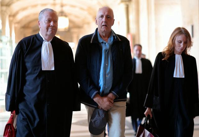 Dany Leprince (C) arrives with his lawyers Olivier Morice (L) and Missiva Chermak Felonneau (R) at Paris courthouse on July 2, 2026 ahead of the decision of the Court of Review reagarding his conviction for the 1994 murders of his brother, sister-in-law and two of their daughters in the Sarthe region of France. The Court of Review will consider the new request of Dany Leprince, sentenced to life imprisonment but who proclaims his innocence and is asking for a second trial, a new stage in the long legal saga of this famous criminal case of a quadruple murder in Sarthe in 1994. (Photo by Thomas SAMSON / AFP)