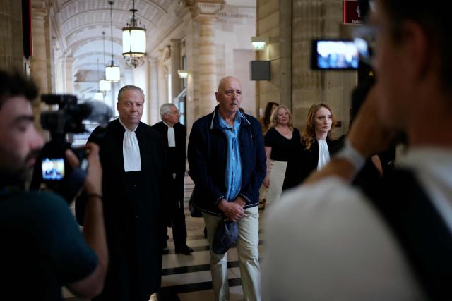 Dany Leprince (C) arrives with his lawyers Olivier Morice (L) and Missiva Chermak Felonneau (R) at Paris courthouse on July 2, 2026 ahead of the decision of the Court of Review reagarding his conviction for the 1994 murders of his brother, sister-in-law and two of their daughters in the Sarthe region of France. The Court of Review will consider the new request of Dany Leprince, sentenced to life imprisonment but who proclaims his innocence and is asking for a second trial, a new stage in the long legal saga of this famous criminal case of a quadruple murder in Sarthe in 1994. (Photo by Thomas SAMSON / AFP)