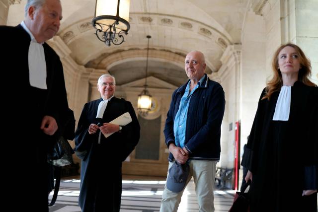 Dany Leprince (2ndR) arrives with his lawyers Olivier Morice (L) and Missiva Chermak Felonneau (R) at Paris courthouse on July 2, 2026 ahead of the decision of the Court of Review reagarding his conviction for the 1994 murders of his brother, sister-in-law and two of their daughters in the Sarthe region of France. The Court of Review will consider the new request of Dany Leprince, sentenced to life imprisonment but who proclaims his innocence and is asking for a second trial, a new stage in the long legal saga of this famous criminal case of a quadruple murder in Sarthe in 1994. (Photo by Thomas SAMSON / AFP)