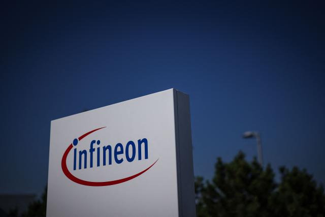 The logo of German semiconductor manufacturer Infineon Technologies AG is seen at the company's plant in Dresden, eastern Germany, on July 2, 2026, prior to the official inauguration of the company's "Smart Power Fab". With an investment of five billion euros, the new facility represents the largest single investment in Infineon's history. (Photo by Ronny HARTMANN / AFP)