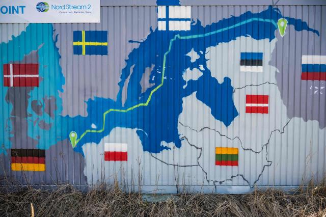 (FILES) A container is decorated with a map showing the Nord Stream 2 gas pipeline, which was expected to deliver Russian gas to European households, in Lubmin's industrial park, northeastern Germany, on March 1, 2022. German prosecutors said on July 2, 2026 that Ukrainian state authorities were behind the 2022 sabotage of the Nord Stream gas pipeline linking Russia with Europe. In a statement detailing the charges brought against a suspect in the case, prosecutors said that he and others had acted "on the orders of state authorities in Ukraine". (Photo by John MACDOUGALL / AFP) / TO GO WITH AFP STORY by Hui Min NEO