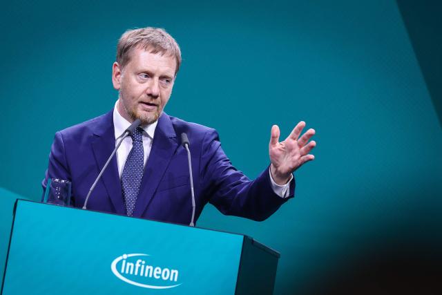 Saxony's State Premier Michael Kretschmer delivers his speech during the opening ceremony of the Infineon Smart Power Fab in Dresden, eastern Germany, on July 2, 2026. German semiconductor giant Infineon officially opens a large new chip factory in eastern Germany on July 2, three months ahead of schedule. The new, highly automated plant -- which cost 5 billion euros ($5.7 billion) -- has been repeatedly held up as a symbol of the European Union's push to bolster the domestic tech sector and reduce dependency for crucial parts on Asia and the United States. (Photo by Ronny HARTMANN / AFP)