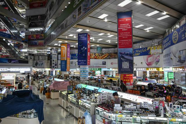 The photo taken on March 17, 2026 shows an interior view of electronics stores at Huaqiangbei Electronic Market in Shenzhen, southern China's Guangdong province. (Photo by Jade GAO / AFP)