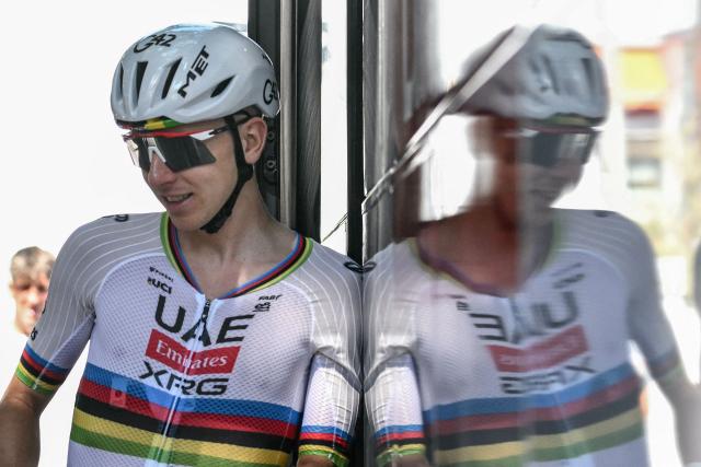UAE Team Emirates - XRG team's Slovenian rider Tadej Pogacar casts a reflection as he disembarks his team bus during a training session two days prior to the start of the 113th edition of the Tour de France cycling race, in Castelldefels near Barcelona in northeastern Spain, on July 2, 2026. (Photo by Jeff PACHOUD / AFP)