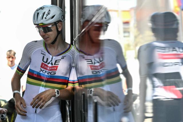UAE Team Emirates - XRG team's Slovenian rider Tadej Pogacar casts a reflection as he disembarks his team bus during a training session two days prior to the start of the 113th edition of the Tour de France cycling race, in Castelldefels near Barcelona in northeastern Spain, on July 2, 2026. (Photo by Jeff PACHOUD / AFP)